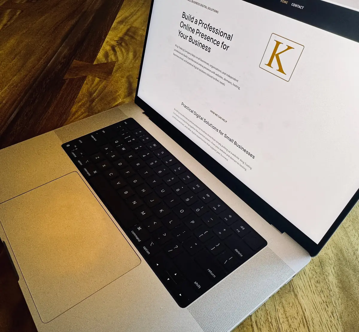 King Trading Company website displayed on a MacBook.,